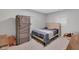 Cozy bedroom with a cushioned headboard bed, two windows, and closet system at 1139 E 35Th St, Indianapolis, IN 46205
