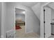 Bright room featuring a charming wooden crib, neutral carpet, and a glimpse of a cozy interior at 1139 E 35Th St, Indianapolis, IN 46205