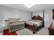 Bedroom featuring a crib, wood-framed bed, carpet and light-colored walls at 1139 E 35Th St, Indianapolis, IN 46205