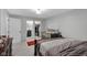 Bedroom featuring a view to the ensuite bathroom, crib and a spacious walk-in closet at 1139 E 35Th St, Indianapolis, IN 46205