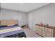 Bedroom featuring neutral walls, carpet and furnishings, including a dresser with baby care products at 1139 E 35Th St, Indianapolis, IN 46205