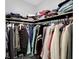 Walk-in closet, fully stocked with clothes hanging on rods and organized on shelves at 1139 E 35Th St, Indianapolis, IN 46205