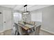 Neutral dining room with modern chandelier, seating for six, and plenty of natural light at 1139 E 35Th St, Indianapolis, IN 46205