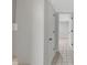 Hallway with a tiled floor, storage closet, and access to additional rooms at 1139 E 35Th St, Indianapolis, IN 46205