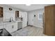 Modern kitchen with white cabinets, stainless steel appliances, and updated backsplash at 1139 E 35Th St, Indianapolis, IN 46205