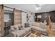 Comfortable living room with stylish decor and a sliding barn door feature at 1139 E 35Th St, Indianapolis, IN 46205