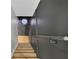 Elegant gray staircase featuring hardwood steps, a unique octagon window, and stylish design at 1139 E 35Th St, Indianapolis, IN 46205