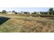 Scenic backyard view with a serene pond and well-maintained lawns, offering a peaceful neighborhood ambiance at 11958 Logan Hunter Trl, Noblesville, IN 46060