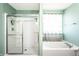 Bathroom featuring a shower and a bathtub, offering options for relaxation and hygiene at 11958 Logan Hunter Trl, Noblesville, IN 46060