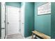 Welcoming entryway featuring light gray tile, a decorative wall sign, and a convenient wooden bench at 11958 Logan Hunter Trl, Noblesville, IN 46060