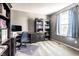 Functional home office with built-in bookshelves, a desk, and a window providing natural light at 11958 Logan Hunter Trl, Noblesville, IN 46060