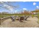 Beautiful backyard patio with pond view, features a fire pit with seating, and a gazebo at 12030 Auburn Creek, Zionsville, IN 46077