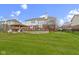 Spacious backyard with covered kitchen and outdoor seating area at 12030 Auburn Creek, Zionsville, IN 46077