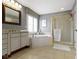 This bathroom features a garden tub, step-in shower, and and vanity at 12030 Auburn Creek, Zionsville, IN 46077