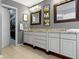 This bathroom features tile flooring, and sinks and large framed mirrors at 12030 Auburn Creek, Zionsville, IN 46077