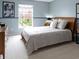Comfortable bedroom featuring a soft color scheme and natural lighting at 12030 Auburn Creek, Zionsville, IN 46077