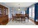Formal dining room with a large wooden table, comfortable seating, and elegant decor at 12030 Auburn Creek, Zionsville, IN 46077