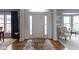 Charming foyer featuring hardwood floors, an area rug, and views into the living spaces at 12030 Auburn Creek, Zionsville, IN 46077