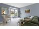 Bright living room featuring a comfortable seating area with plush furniture and natural light from large windows at 12030 Auburn Creek, Zionsville, IN 46077