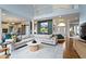 Bright living room with high ceilings and connected open kitchen and staircase leading to the upper floor at 12030 Auburn Creek, Zionsville, IN 46077