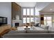 Bright living room features vaulted ceiling, expansive windows, fireplace and opens up to the gourmet kitchen at 12030 Auburn Creek, Zionsville, IN 46077