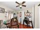 Bedroom with hardwood floors, ceiling fan, and a view of the laundry area at 1270 Eugene St, Indianapolis, IN 46208