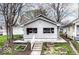 Charming single-story home featuring light-colored siding and a small front yard garden area at 1270 Eugene St, Indianapolis, IN 46208