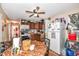Functional kitchen with wooden cabinets, appliances, and a cozy dining area with a unique round table at 1270 Eugene St, Indianapolis, IN 46208