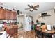 This kitchen provides tiled floors, wooden cabinetry, and access to the outside at 1270 Eugene St, Indianapolis, IN 46208