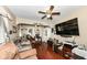 Comfortable living room with hardwood floors, ceiling fan, and a large television at 1270 Eugene St, Indianapolis, IN 46208