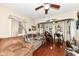Inviting living room featuring hardwood floors, ceiling fan, and an archway leading to another room at 1270 Eugene St, Indianapolis, IN 46208