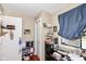 This small office features wood floors, a window, and ample storage space at 1270 Eugene St, Indianapolis, IN 46208
