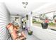 Cozy porch with orange chairs, plants, and a view of the neighborhood at 1270 Eugene St, Indianapolis, IN 46208