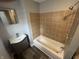 Bathroom featuring a tub and shower combination, a new vanity, and new vinyl flooring at 1308 W 18Th St, Indianapolis, IN 46202