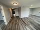 Inviting living room featuring sleek flooring and neutral paint, creating a modern and airy atmosphere at 1308 W 18Th St, Indianapolis, IN 46202
