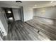 Spacious living room with grey walls, vinyl flooring, recessed lighting, and natural light at 1308 W 18Th St, Indianapolis, IN 46202
