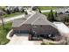 Brick home with a spacious three car garage and inground pool at 13214 Mink Ln, Carmel, IN 46074