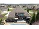Expansive backyard featuring a pool, patio, and outdoor seating area at 13214 Mink Ln, Carmel, IN 46074