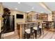 Finished basement featuring a fully stocked bar with rustic wood accents and ample seating space at 13214 Mink Ln, Carmel, IN 46074