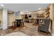 Entertainment basement space with a bar, stools, and a rustic design at 13214 Mink Ln, Carmel, IN 46074