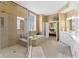 Bright bathroom with separate glass shower, soaking tub, and double sink vanity at 13214 Mink Ln, Carmel, IN 46074