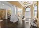 Grand foyer with high ceilings, elegant columns, and dark hardwood floors welcomes you home at 13214 Mink Ln, Carmel, IN 46074