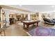 Entertainment area featuring a pool table, bar, and comfortable seating at 13214 Mink Ln, Carmel, IN 46074