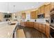 Well-equipped kitchen featuring stainless steel appliances, granite countertops, and ample cabinet space at 13214 Mink Ln, Carmel, IN 46074