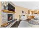 Inviting living room with stone fireplace, TV, and comfortable seating for relaxation at 13214 Mink Ln, Carmel, IN 46074