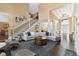 Spacious living room with staircase, high ceilings, and elegant foyer at 13214 Mink Ln, Carmel, IN 46074