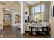 Bright living room with custom built-ins, fireplace, and large windows allowing for ample natural light at 13214 Mink Ln, Carmel, IN 46074