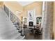 Spacious living room with fireplace, built-in shelving, and staircase at 13214 Mink Ln, Carmel, IN 46074