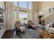Inviting living room space with comfortable seating and views of the landscaped yard at 13214 Mink Ln, Carmel, IN 46074