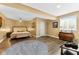 Spacious main bedroom with a ceiling fan, neutral tones, and stylish furnishings at 13214 Mink Ln, Carmel, IN 46074